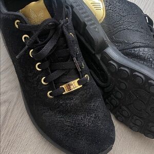 Adidas Black Sneakers with Gold Highlights